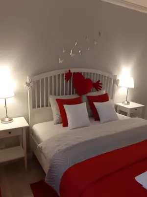 a bedroom with a bed with a teddy bear on it at Apartament FAMILY- klimatyzacja in Oświęcim