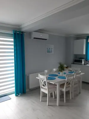 a dining room with a table and chairs at Apartament FAMILY- klimatyzacja in Oświęcim