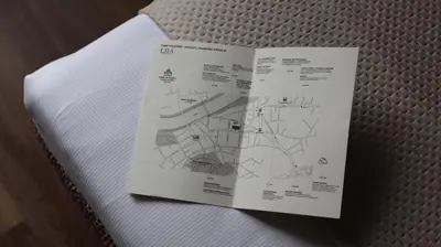 a book with a diagram on a piece of paper at Apartamenty Delecta in Kraków