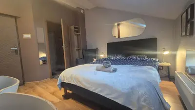 a bedroom with a large bed in a room at Guesthouse Prusa 7 in Oświęcim