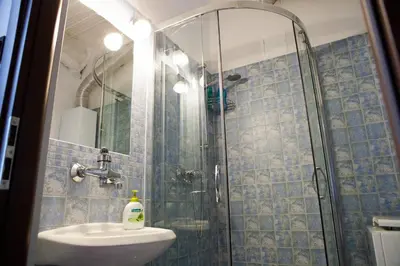 a bathroom with a shower and a sink at Charming apt Old Town & Jewish District, quiet neighborhood in Kraków