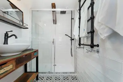 a bathroom with a shower and a sink at Apartments Starowislna Kazimierz Cracow by Noclegi Renters in Kraków