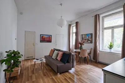 a living room with a couch and a table at Urban Nest Apartments Świętego Marka27 in Kraków