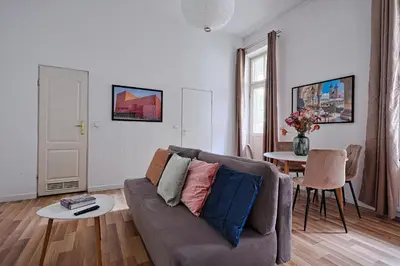 a living room with a couch and a table at Urban Nest Apartments Świętego Marka27 in Kraków