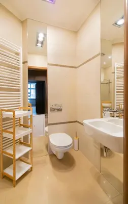 a bathroom with a toilet and a sink at Collosal 6 bedroom apartment Słowackiego avenue in Kraków