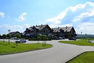 a winding road in front of a house at Hotel Oriza in Gdów