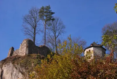 an old building on top of a hill with trees at Pokoje Gościnne u Grażyny in Ojców