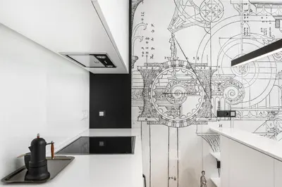 a kitchen with a drawing on the wall at White Room Piłsudskiego 1 in Kraków