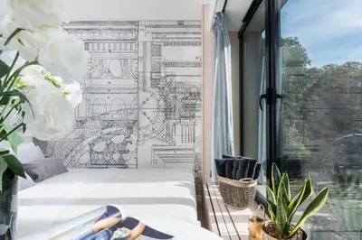 a room with a balcony with two beds and a window at White Room Piłsudskiego 1 in Kraków