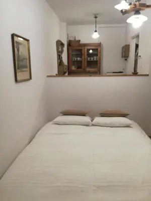 a bed in a room with two pillows at Pokój z widokiem in Kraków