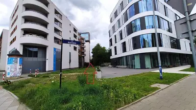 a street sign in front of two tall buildings at Dworska 1A - studio by Homeprime in Kraków