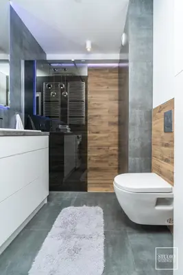 a bathroom with a toilet and a sink at Exclusive Vermelo Apartment in Kraków