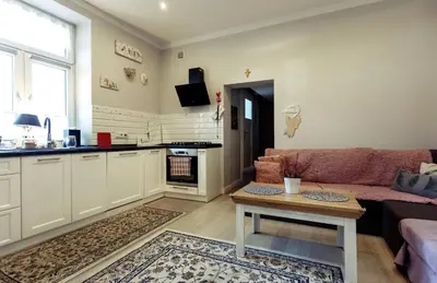 a living room with a couch and a table at Apartment Cracow in Kraków