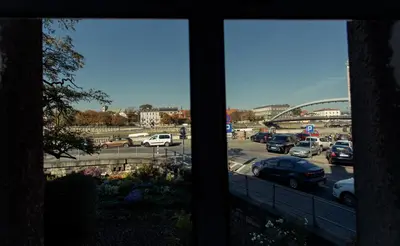 a view from a window of a parking lot with cars at Apartment Cracow in Kraków
