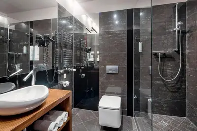 a bathroom with a sink and a shower at Hotel Unicus Krakow Old Town - Destigo Hotels in Kraków