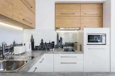 a kitchen with a sink and a microwave at City of the Kings-Silver Apartment No 2- Lubelska 10 in Kraków