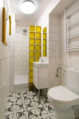 a bathroom with a sink and a toilet at Vintage Apartment Gertrudy street in Kraków
