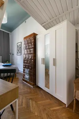 a living room with a sliding door and a table at Vintage Apartment Gertrudy street in Kraków