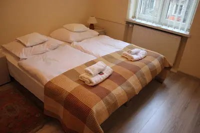 two towels on a bed in a bedroom at CDR in Kraków