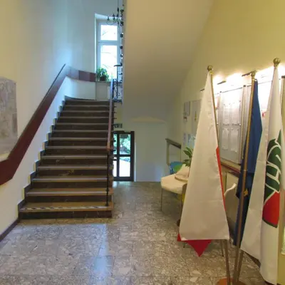 a staircase in a building with a flag at CDR in Kraków