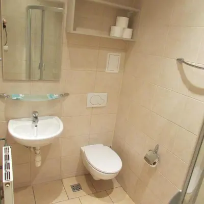 a bathroom with a toilet and a sink at CDR in Kraków