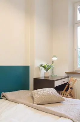 a bedroom with a bed and a desk at Unique apartments Krasinskiego street in Kraków