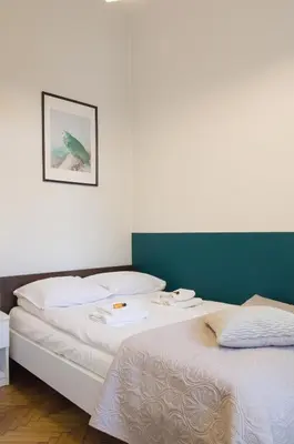 two beds sitting next to each other in a room at Unique apartments Krasinskiego street in Kraków