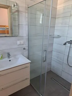 a bathroom with a shower and a sink at Zajazd na Podzamczu in Pieskowa Skała