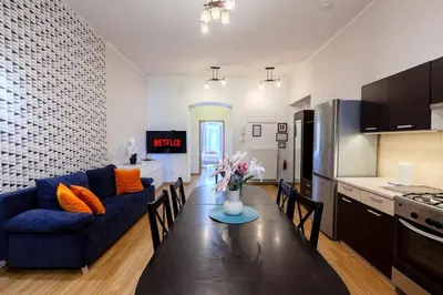 a kitchen with a microwave and a stove top oven at Castle View Krasinskiego Avenue in Kraków