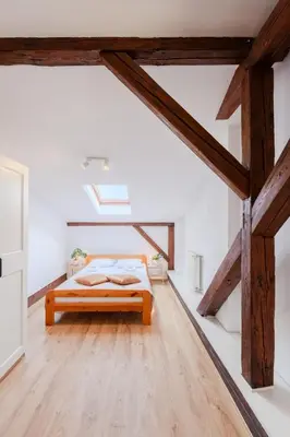 a spiral staircase with a window in a building at Quiet Loft Michalowskiego Street in Kraków