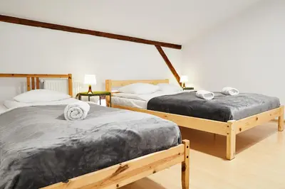 a living room with a couch and a table at Quiet Loft Michalowskiego Street in Kraków