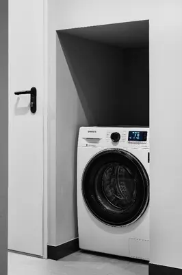a washer and dryer in a room at Compact Studios Słowackiego Avenue in Kraków