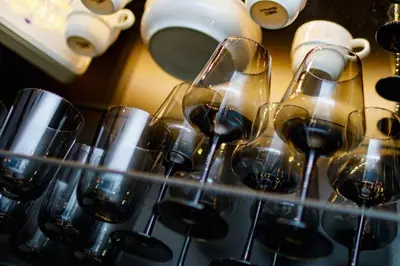 a bunch of wine glasses on a shelf at Apartments Kraków Masarska Free Parking by Noclegi Renters in Kraków