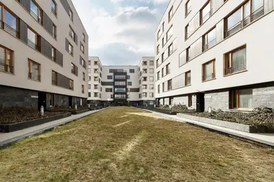 an empty alley between two buildings at Apartments Kraków Masarska Free Parking by Noclegi Renters in Kraków