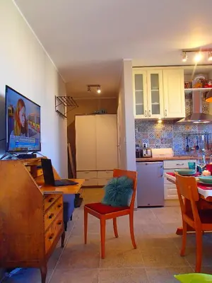 a living room with a kitchen and a dining room at Cracovia Panorama East Apartment Vermelo in Kraków