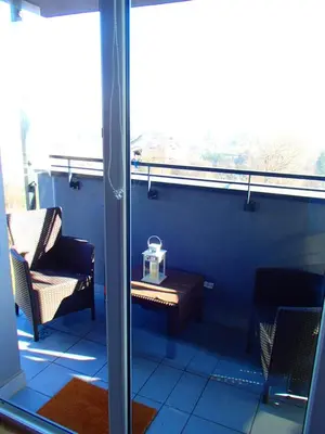 a room with a table and chairs and a window at Cracovia Panorama East Apartment Vermelo in Kraków