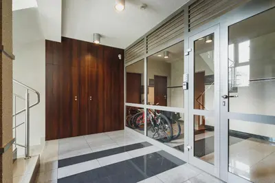 a room with a motorcycle inside of a building at Apartments Kraków Wiślane Tarasy by Noclegi Renters in Kraków