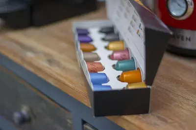a box of colored pencils sitting on a table at caput mundi in Kraków