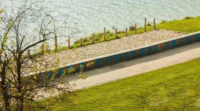 a path next to a body of water at MY KRAKOW Apartments - Pianissimo in Kraków