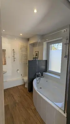 a bathroom with a tub and a sink and a toilet at Agroturystyka SPA in Zelków