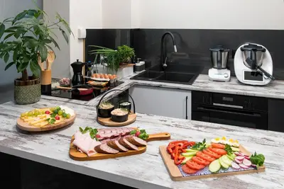 a kitchen counter with several plates of food on it at KP Claudia in Wieliczka