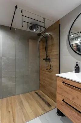 a shower with a glass door in a bathroom at Staymoovers - Piękna Willa w pobliżu Krakowa in Paszkówka