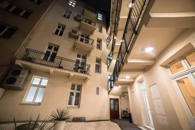a large building with balconies on the side of it at CracWoW Apartment in Kraków