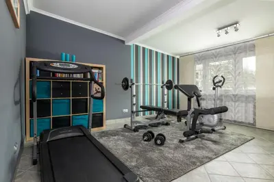a gym with exercise equipment in a room at Prywatna Rezydencja Marylin Monroe Rabka in Rabka