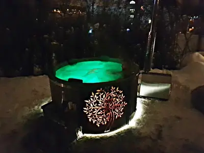 a bucket with a green pool of water at night at Prywatna Rezydencja Marylin Monroe Rabka in Rabka