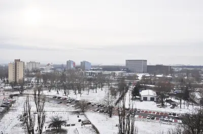 a view of a city in the snow at Os. 2 pułku 26 - studio by Homeprime in Kraków