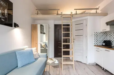 a small apartment with a bunk bed in a room at Solna Atelier in Kraków