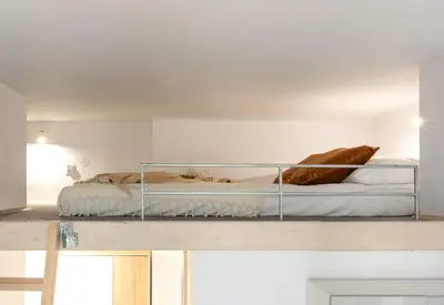 a bedroom with a bunk bed on a shelf at Solna Atelier in Kraków
