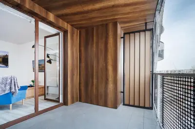 a room with a wooden door and a mirror at PIANISSIMO in Kraków