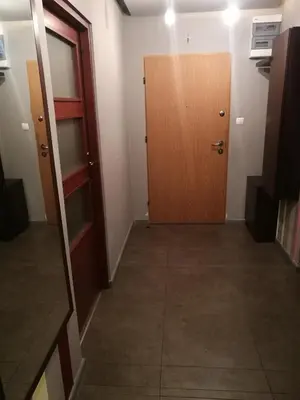 an empty room with a door and a hallway at Salt Mine Apartment 64m2 in Wieliczka